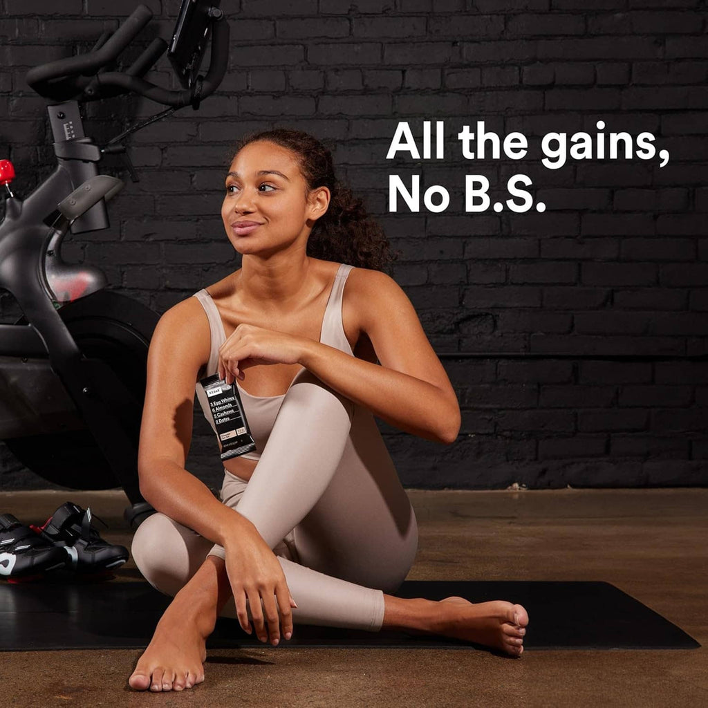 Athlete holding an RxBAR protein bar packet during workout event