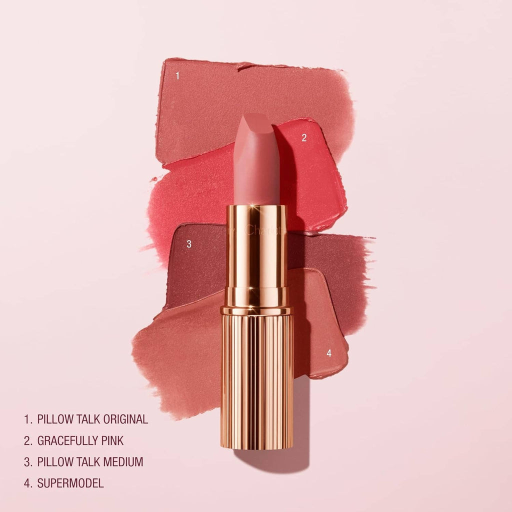 Rose-gold Charlotte Tilbury matte lipstick on coral lip color swatches, four tones shown