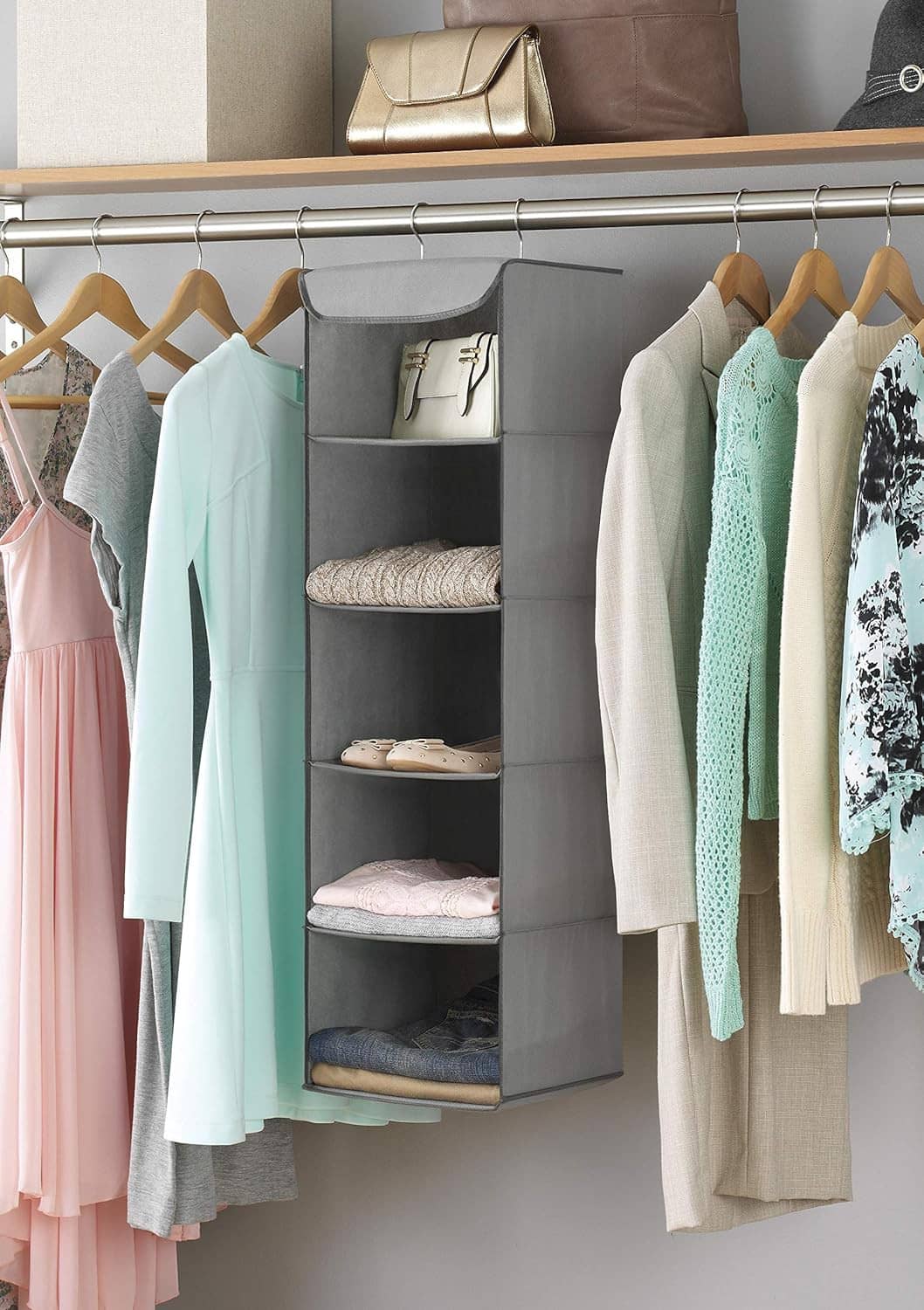 Gray fabric hanging closet organizer with metal frame, open shelves for folded clothes and shoes