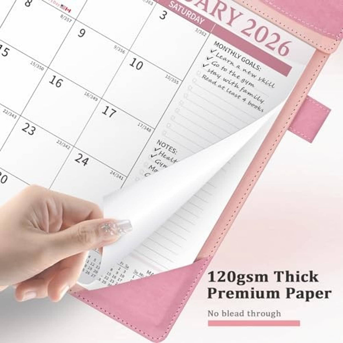 Pink desk calendar with thick paper page, showing writing lines and notes area