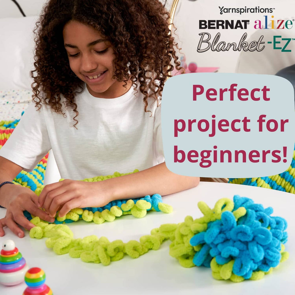 Child finger-knitting with green and blue Blanket-EZ loop yarn, beginner-friendly kit