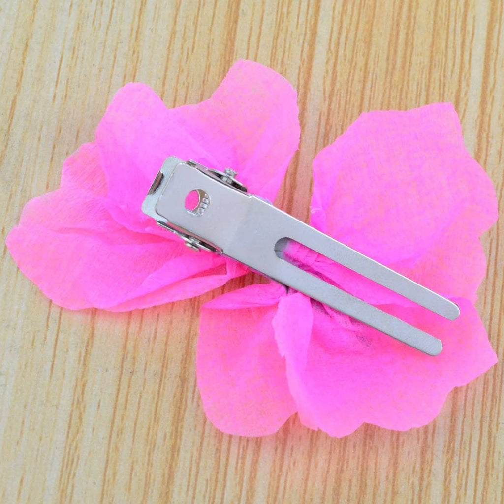 Silver double-prong hair curl setting clip resting on pink flowers
