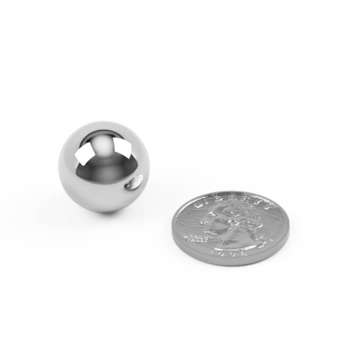 Single large carbon steel ball bearing with internal balls, beside coin for scale