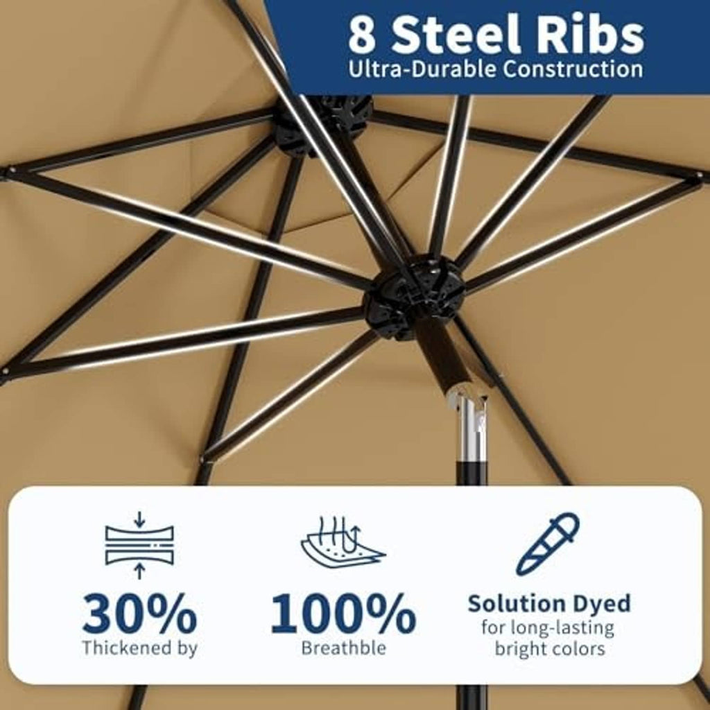 Tan patio umbrella canopy with black steel ribs and center crank hub