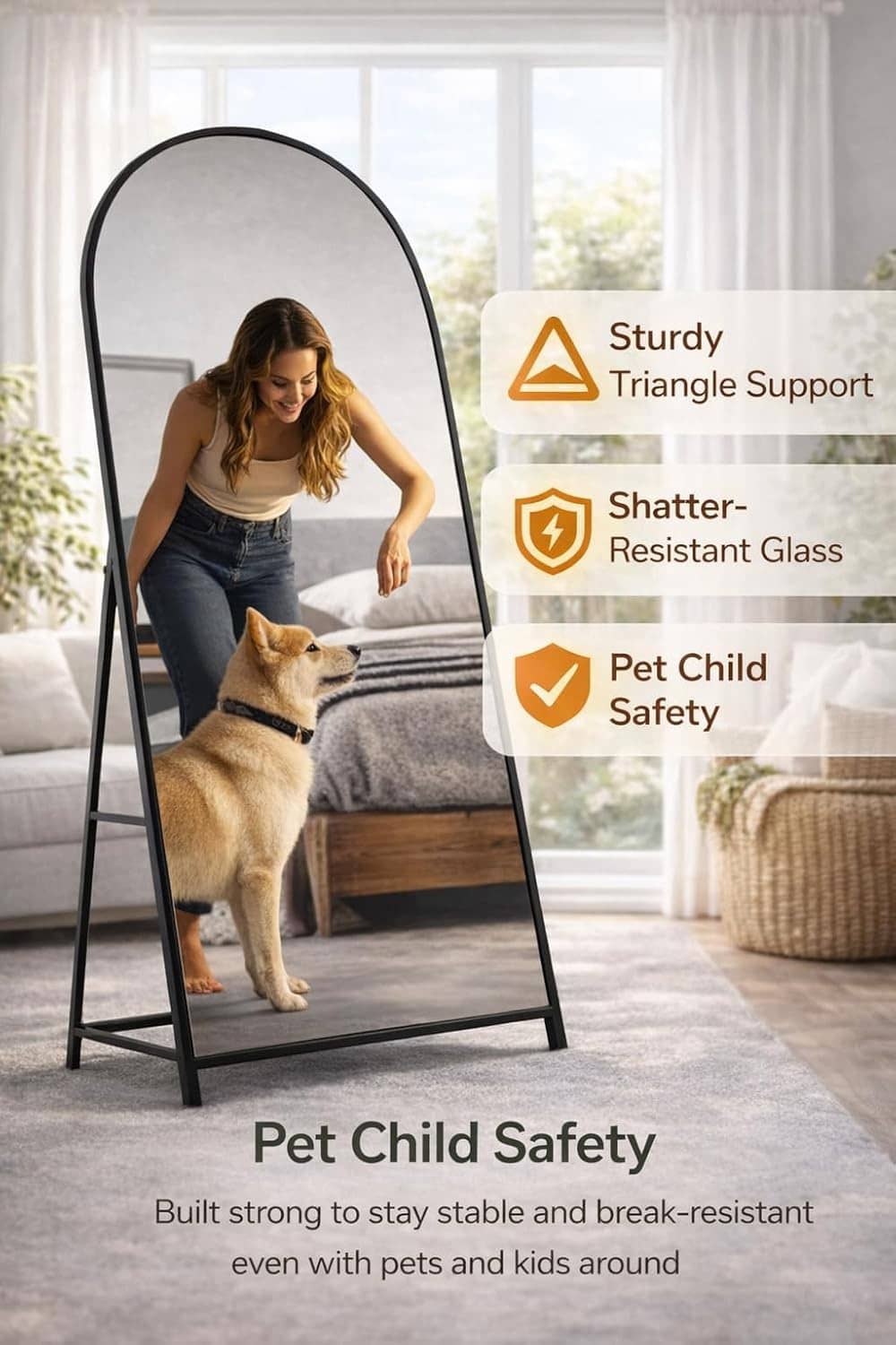 Arched full-length floor mirror with black frame, with a person and dog near the stand.