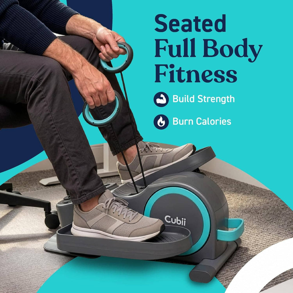 Under-desk elliptical bike with resistance bands, seated user pedaling and holding handles