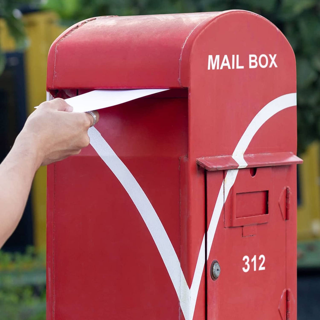 White vinyl letters applied on a mailbox with number 312