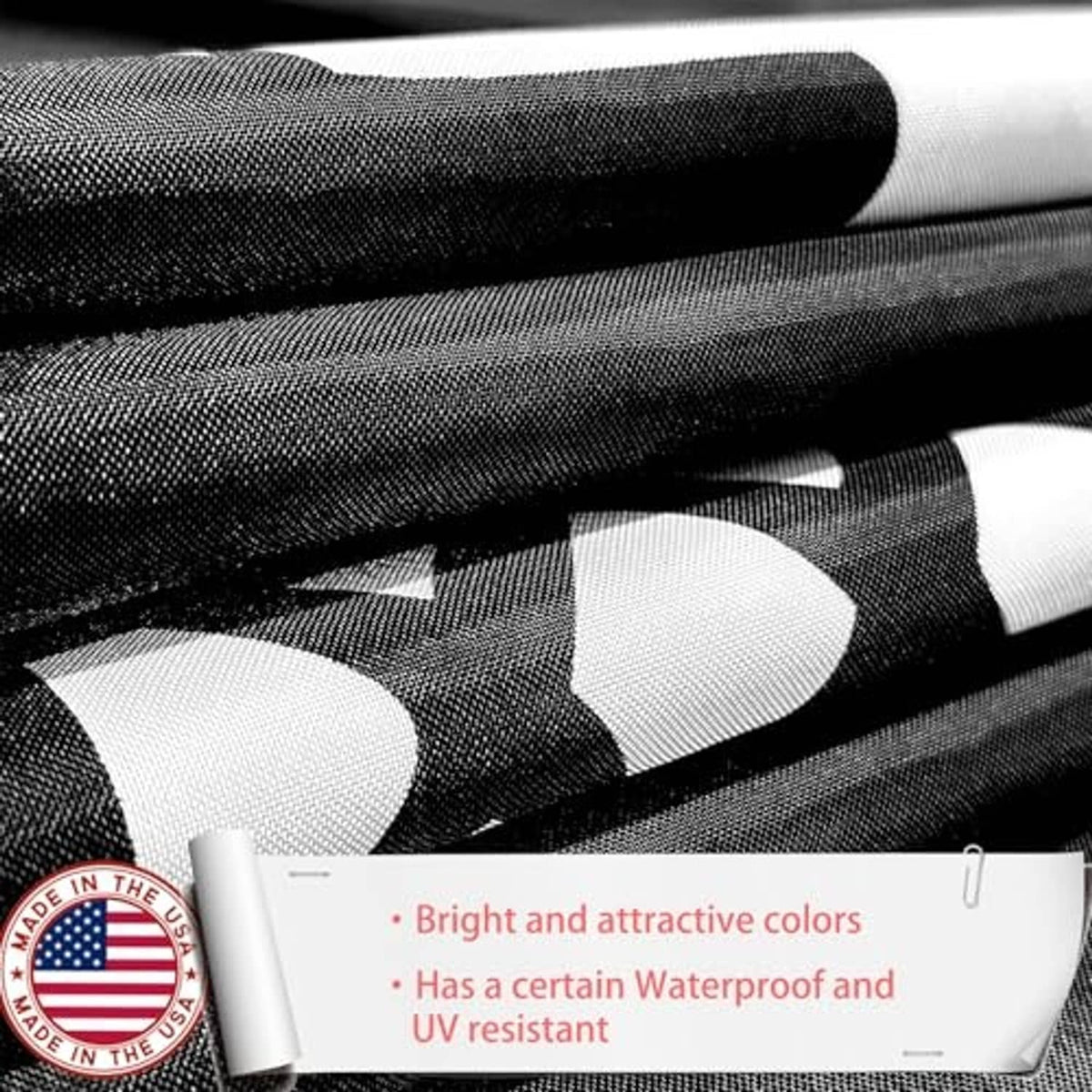 Close-up of black nylon flag fabric with printed POW-MIA style emblem