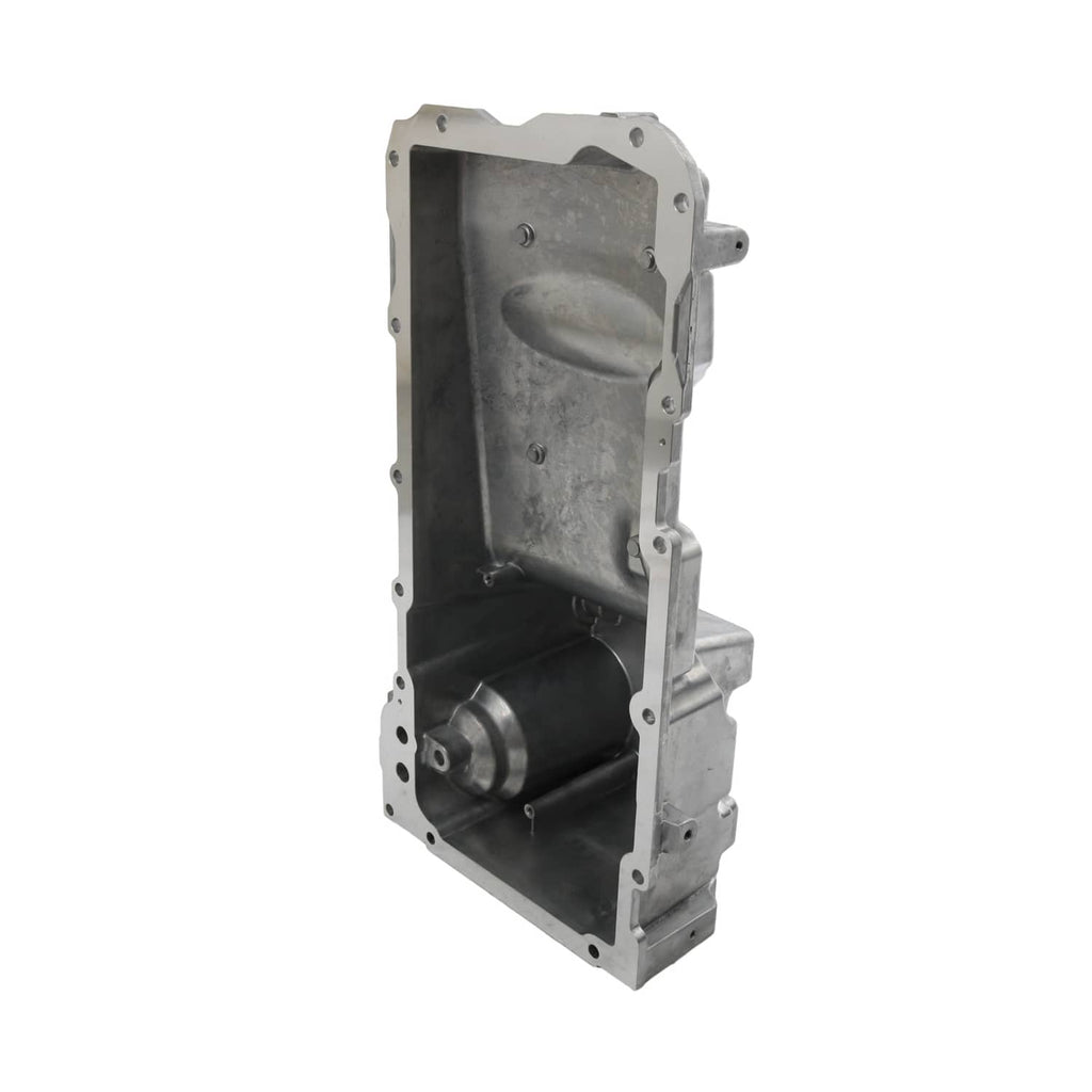 Engine oil pan kit end view of enclosed chamber with circular port and mounting holes
