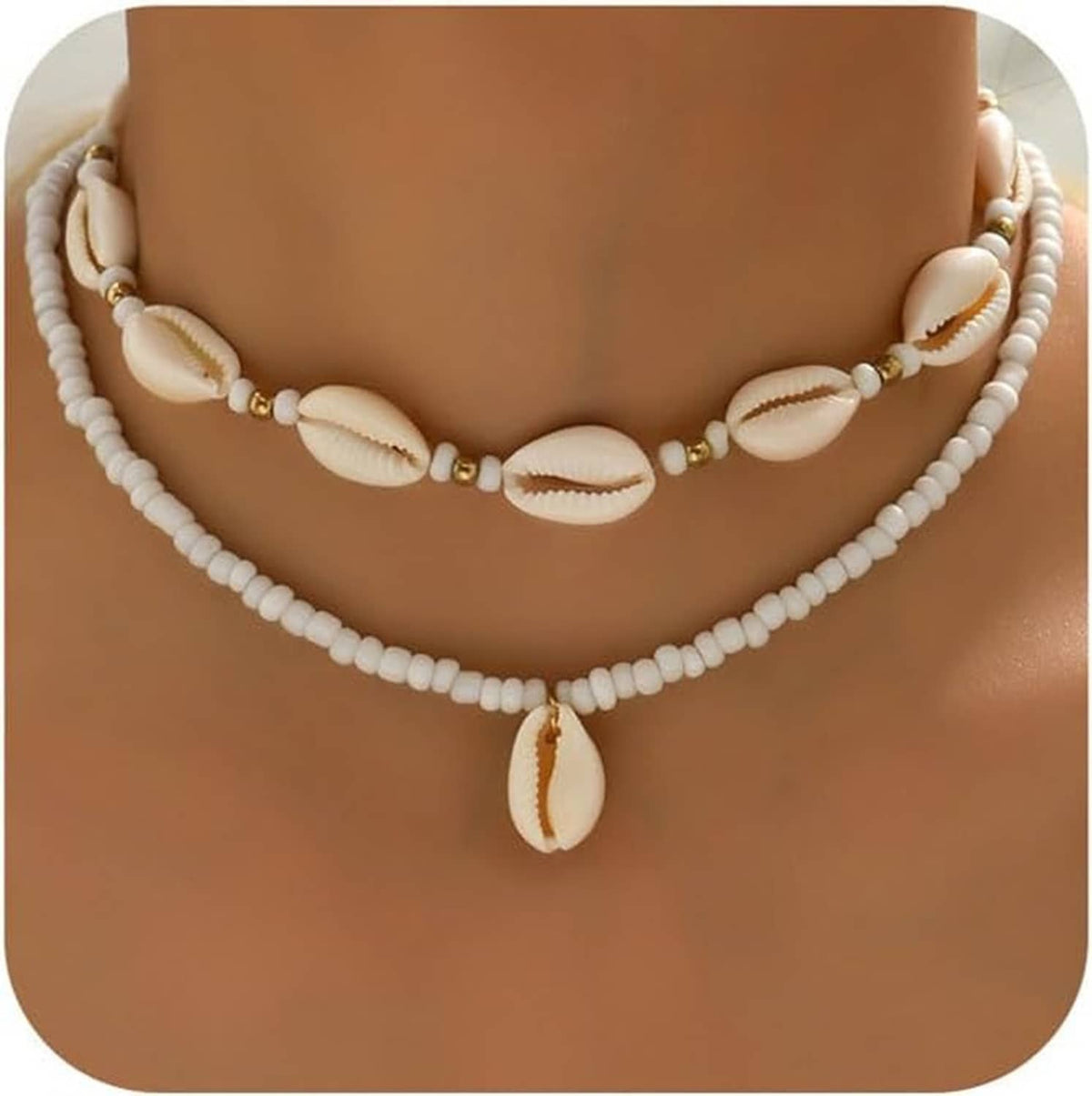Layered natural shell bead necklace with cowrie-style shells and small gold spacers