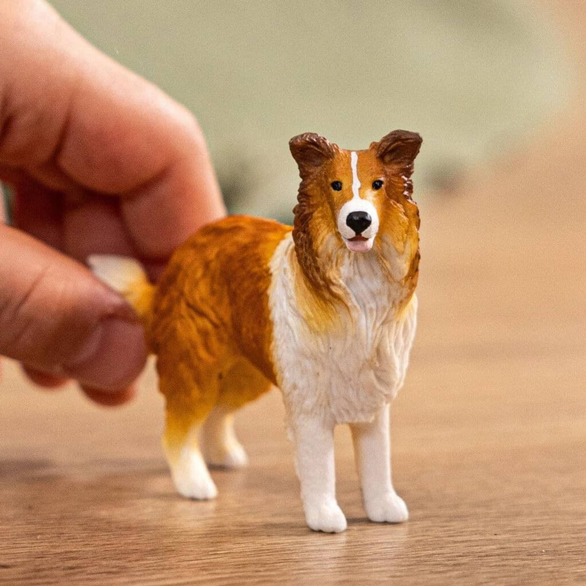 Realistic collie dog figurine, tan coat with white chest and ruff