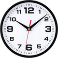 Black analog wall clock with white dial, large numerals, red second hand and black hands