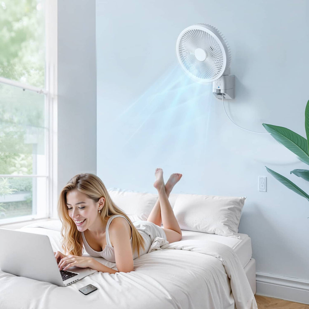 Wall-mounted oscillating fan blowing air toward a bed area