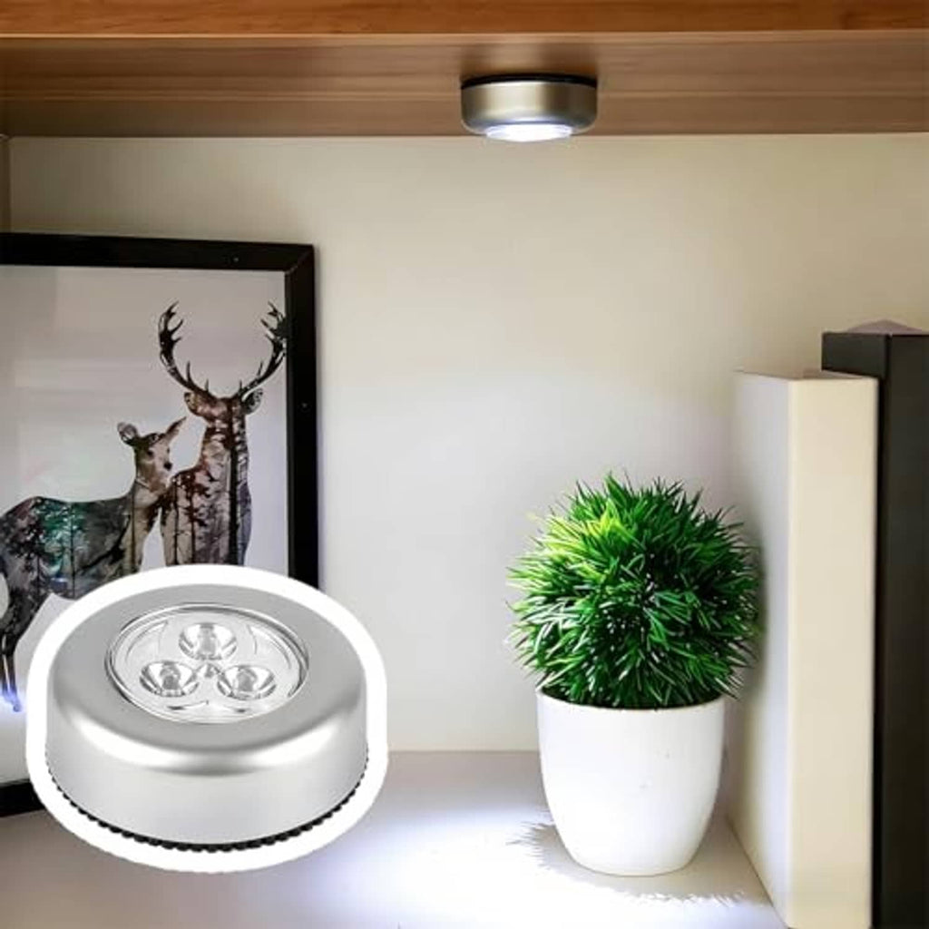 Silver round LED dome light installed under vehicle ceiling