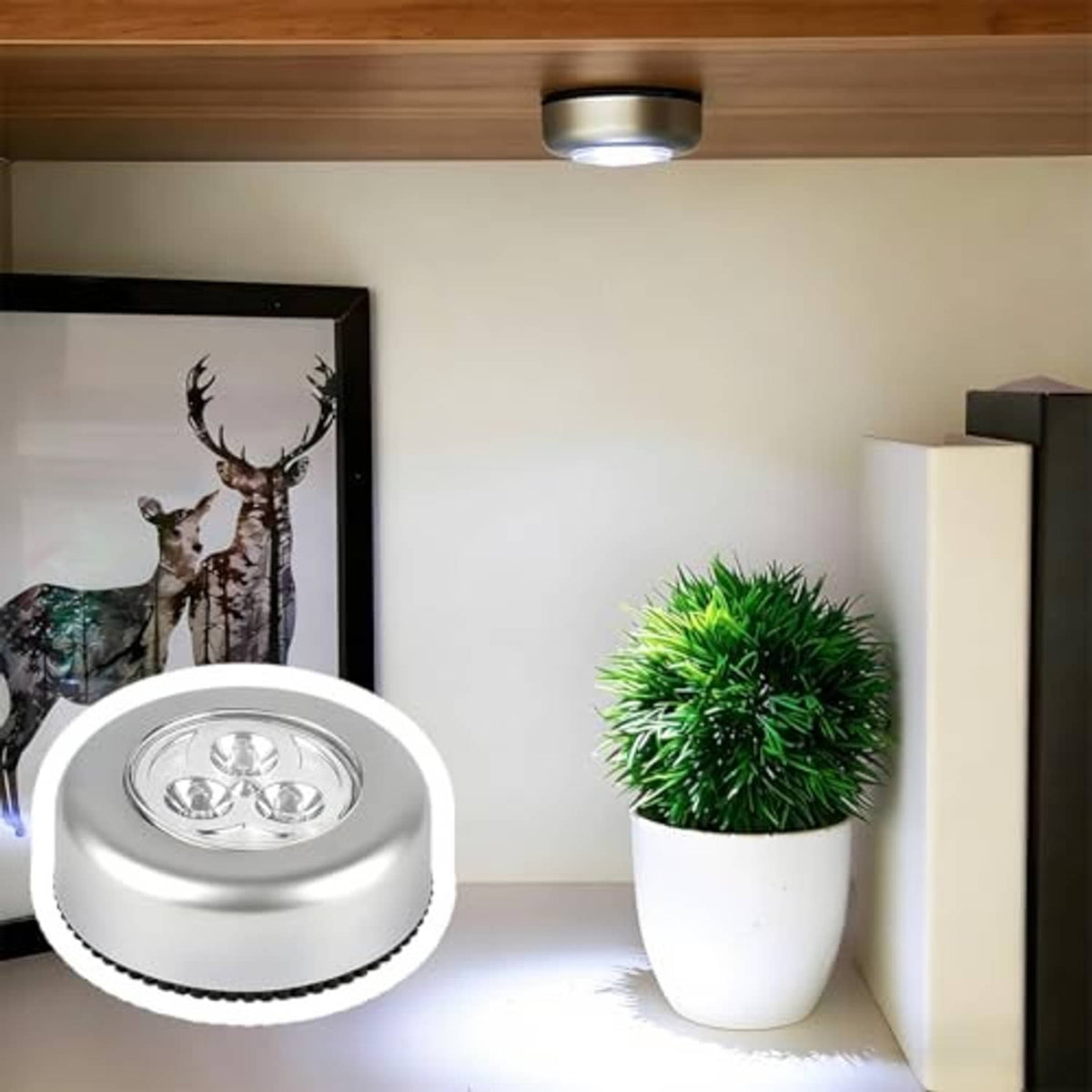 Silver round LED dome light installed under vehicle ceiling