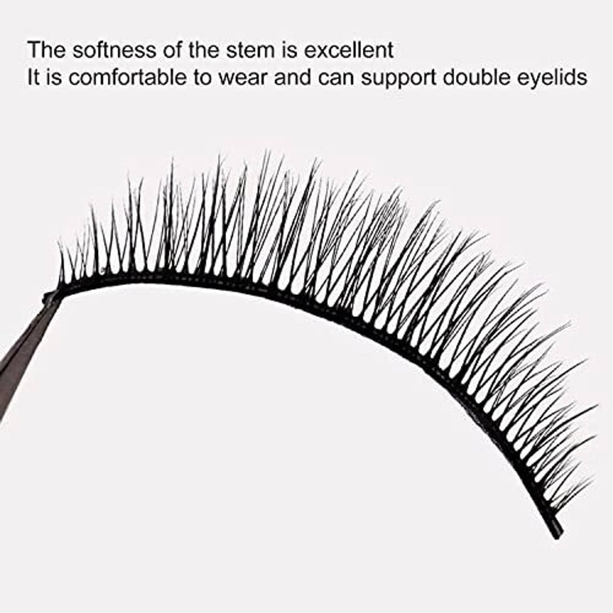 Black false eyelash strip with soft flexible band and dense wispy fibers