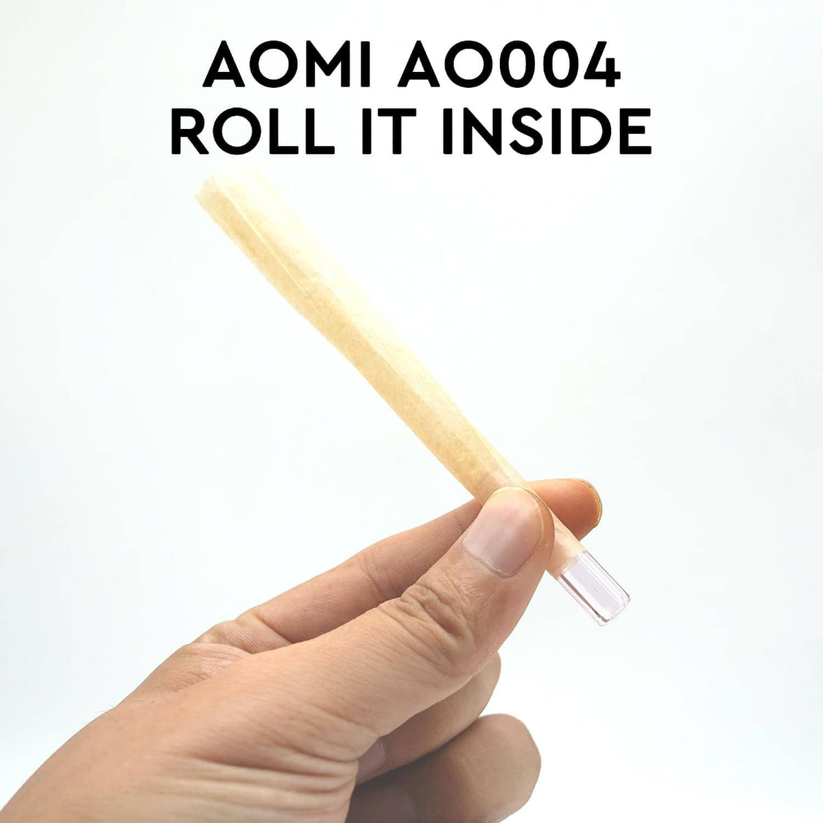Hand holding a reusable glass filter tip mouthpiece with clear end