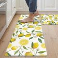 Set of 2 white lemon-print anti-fatigue kitchen rugs with cushioned surface