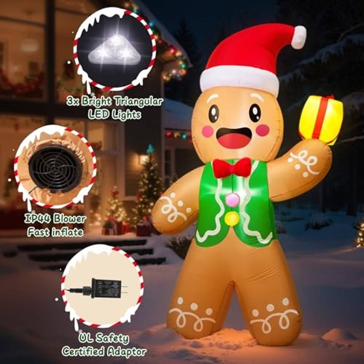 Gingerbread man inflatable with red Santa hat and green icing suit, holding a yellow gift