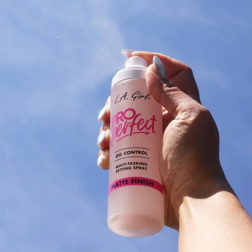 L.A. Girl Pro Perfect setting spray bottle held in hand, matte finish label