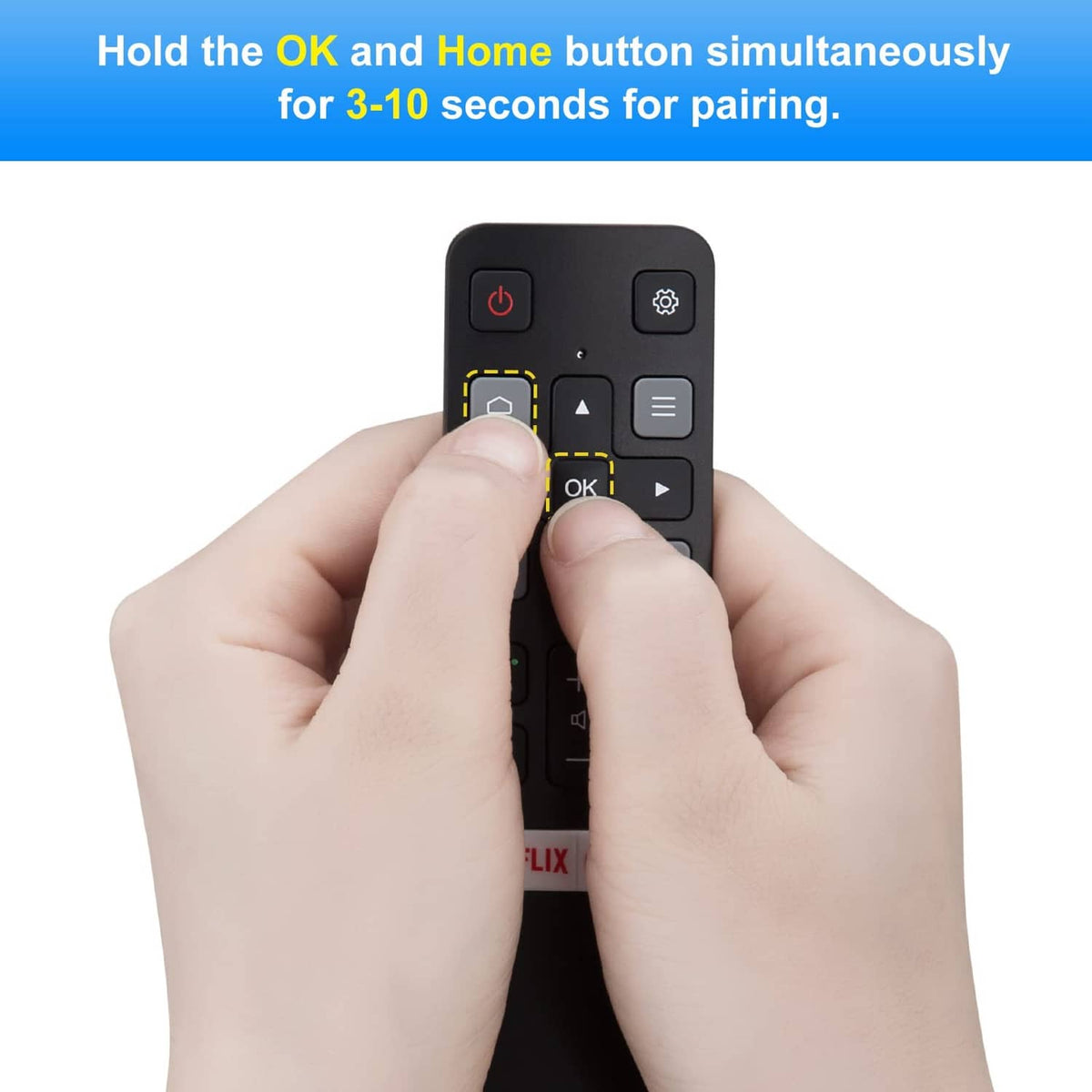 Black voice remote with a thumb pressing the OK button for pairing