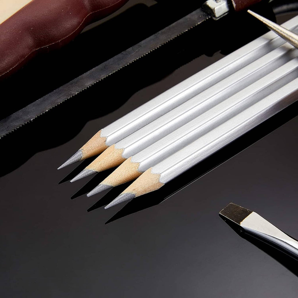 Close-up of silver metallic marking pencils with sharpened pointed tips.