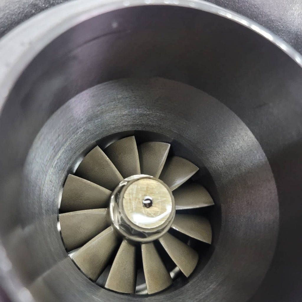 Turbocharger turbine wheel inside inlet housing, close-up view