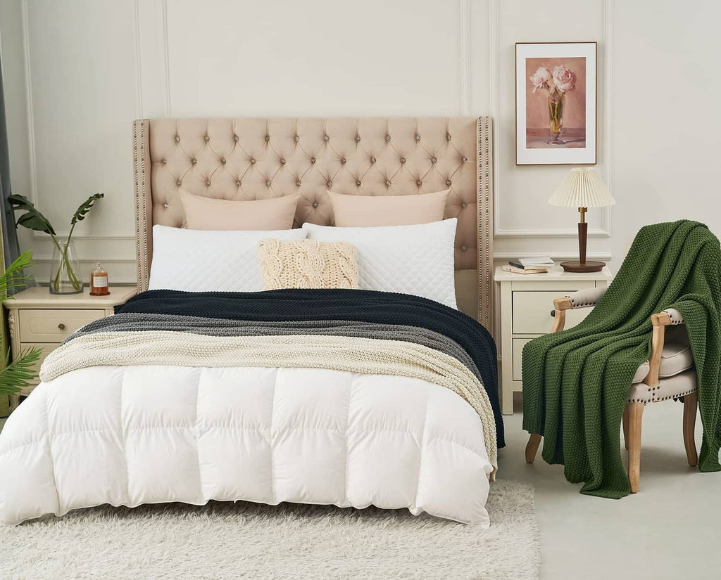 Olive green chunky cable knit throw blanket draped over a bed
