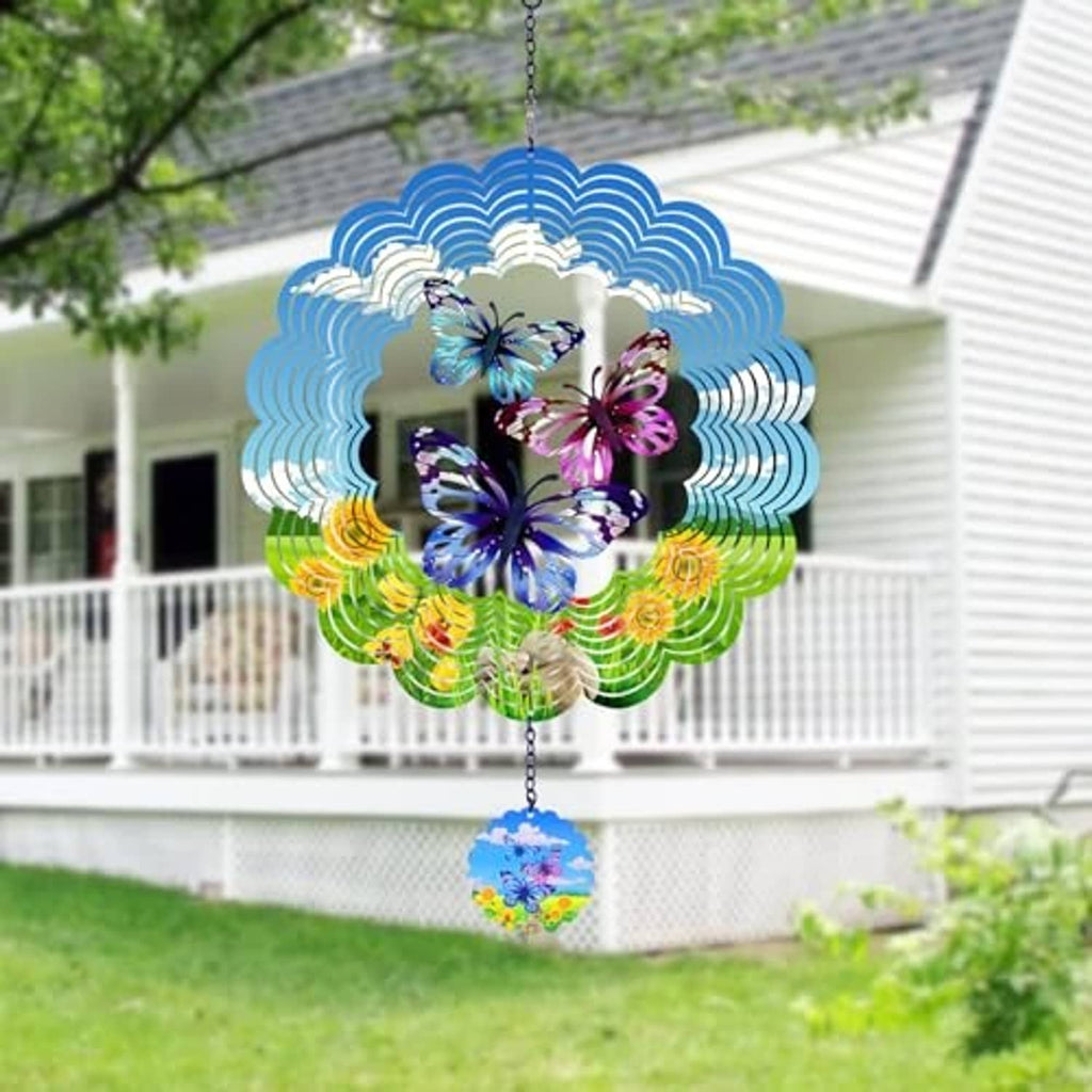 Butterfly wind spinner hanging in garden with blue-green scalloped metal and butterfly cutouts