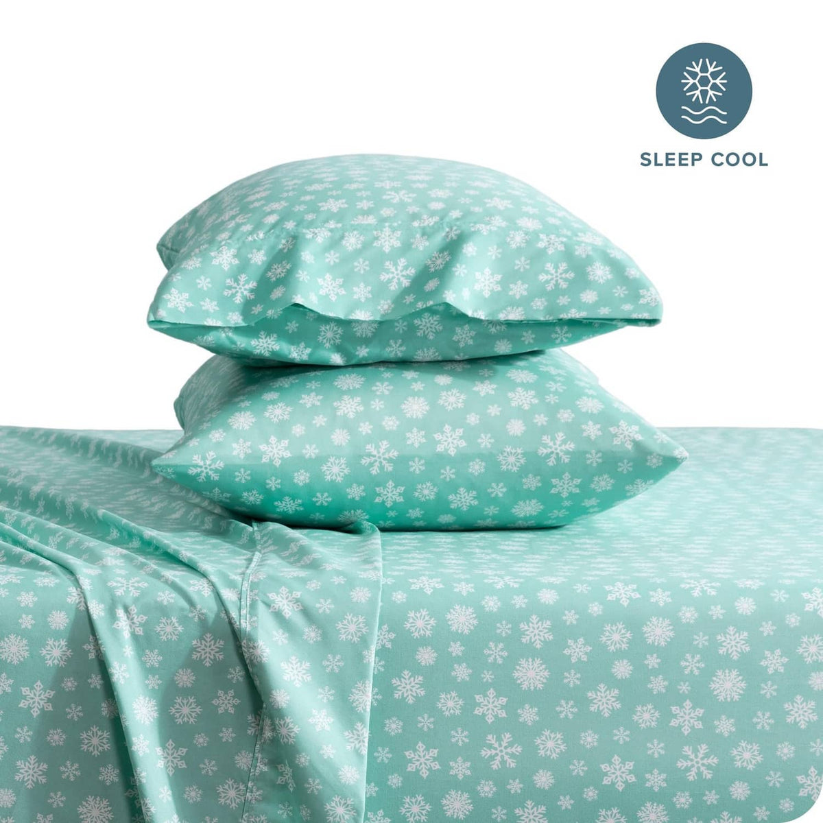 Teal snowflake pillowcases and bedding stack for a full bed sheet set