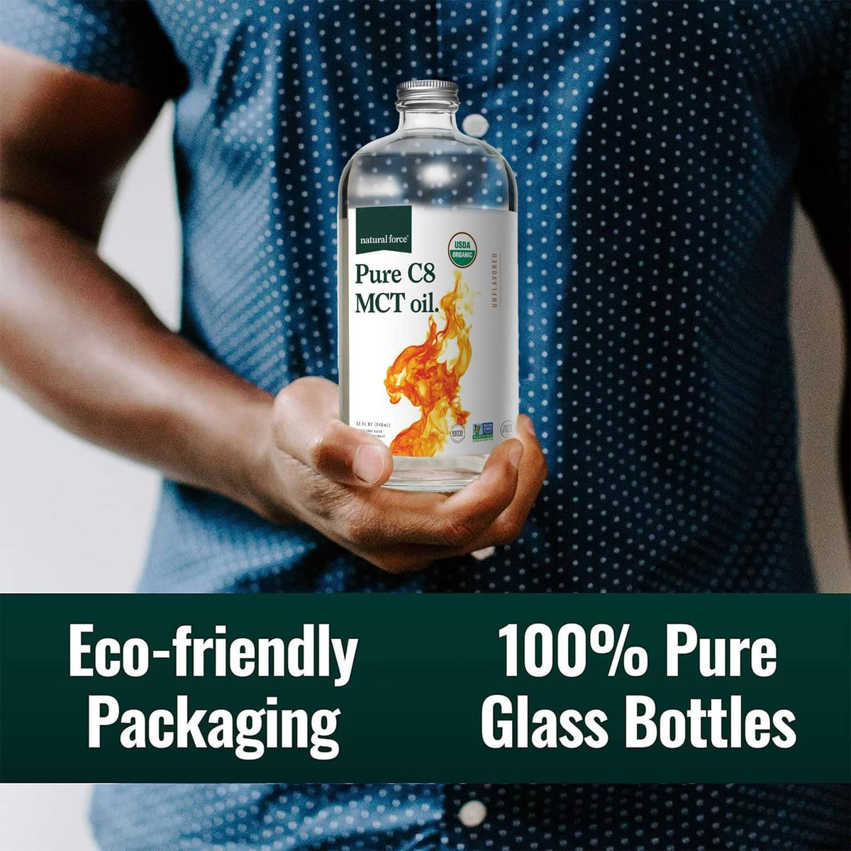 Hand holding a glass bottle of Pure C8 MCT oil with flame label and silver cap