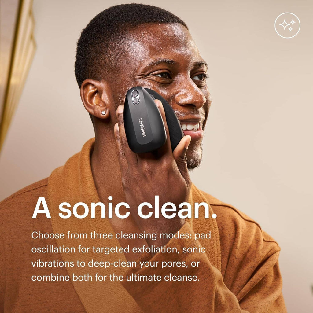 Men using electric silicone face scrubber on cheek with handheld device