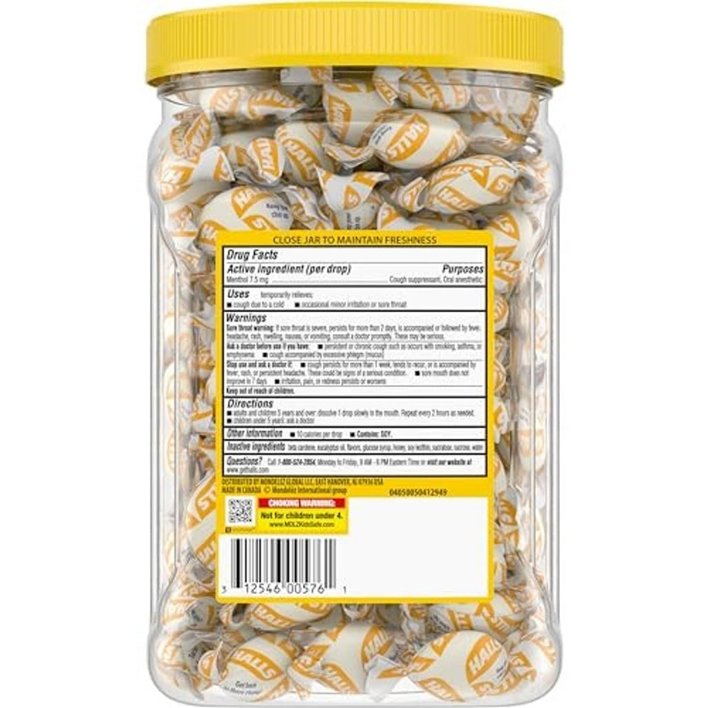 Jar of honey lemon menthol cough drops, yellow lid, back label visible.