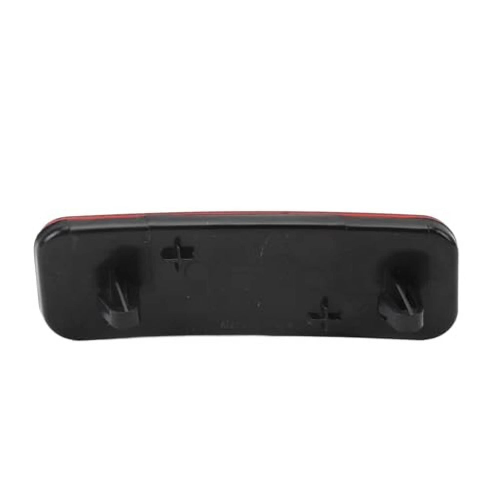 Back of rear bumper reflector with black plastic housing and mounting tabs