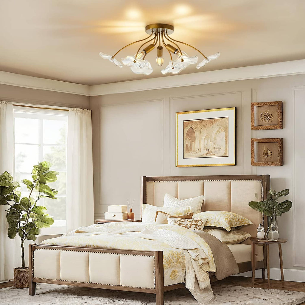Brass semi flush ceiling light with five clear glass shades in a bedroom