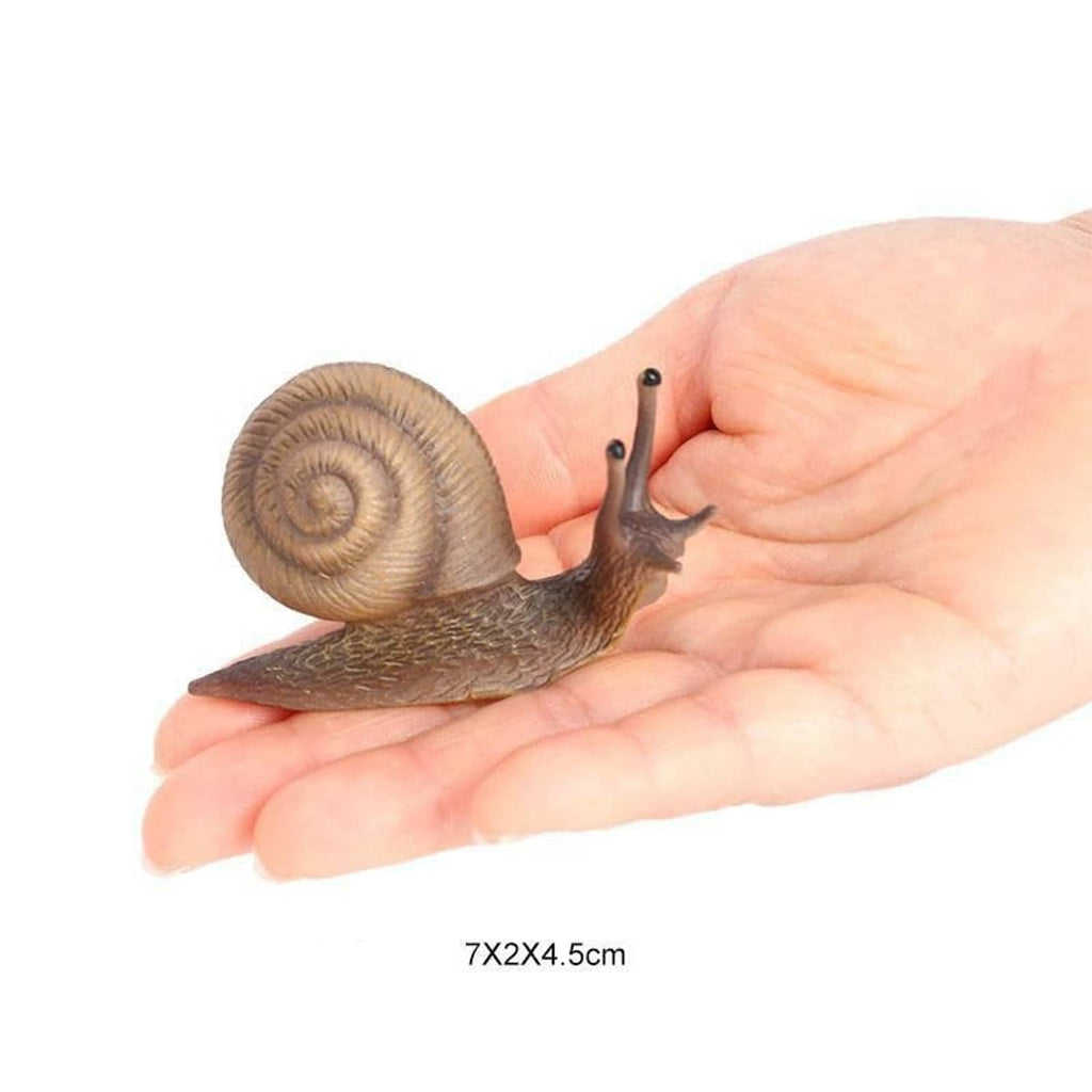 Realistic mini snail figurine held in a hand, brown spiral shell and beige body underside.