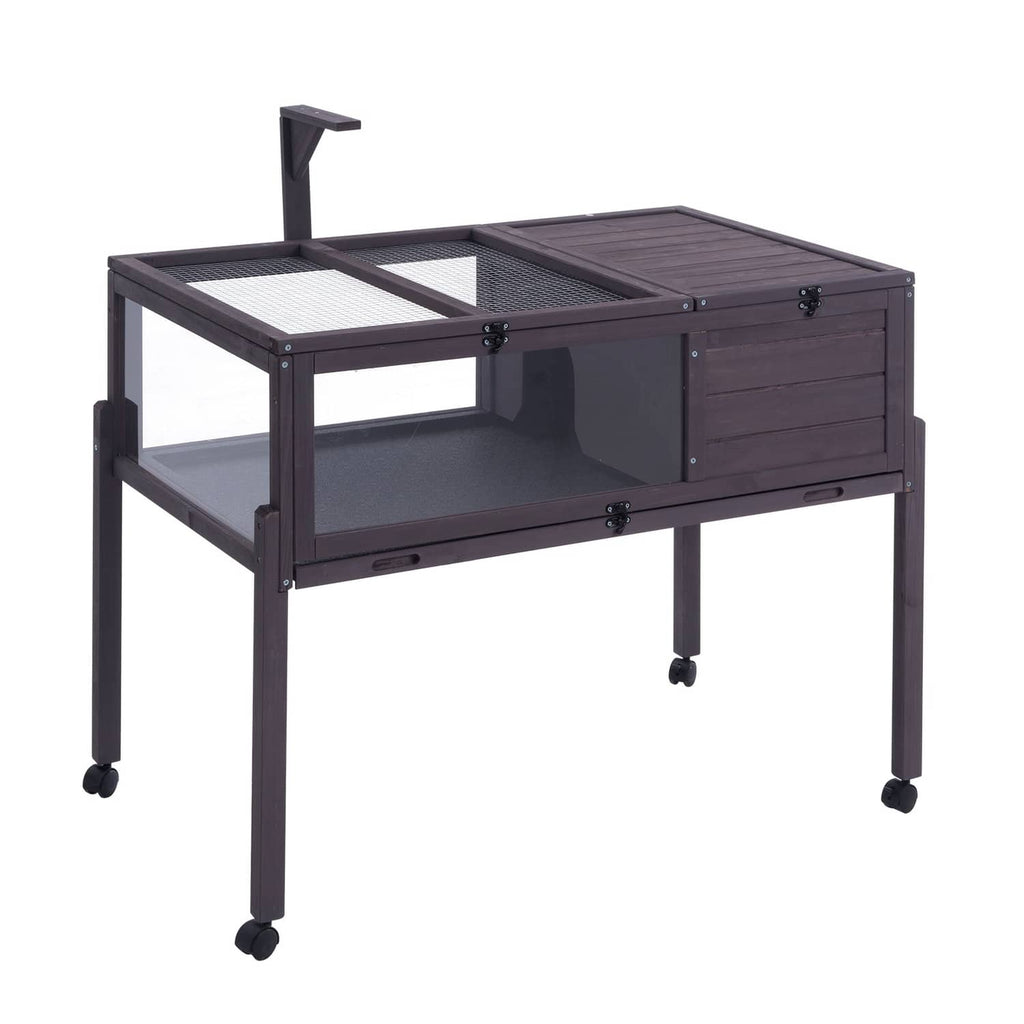 Dark wooden tortoise habitat with mesh panel, hinged top, and rolling drawer base