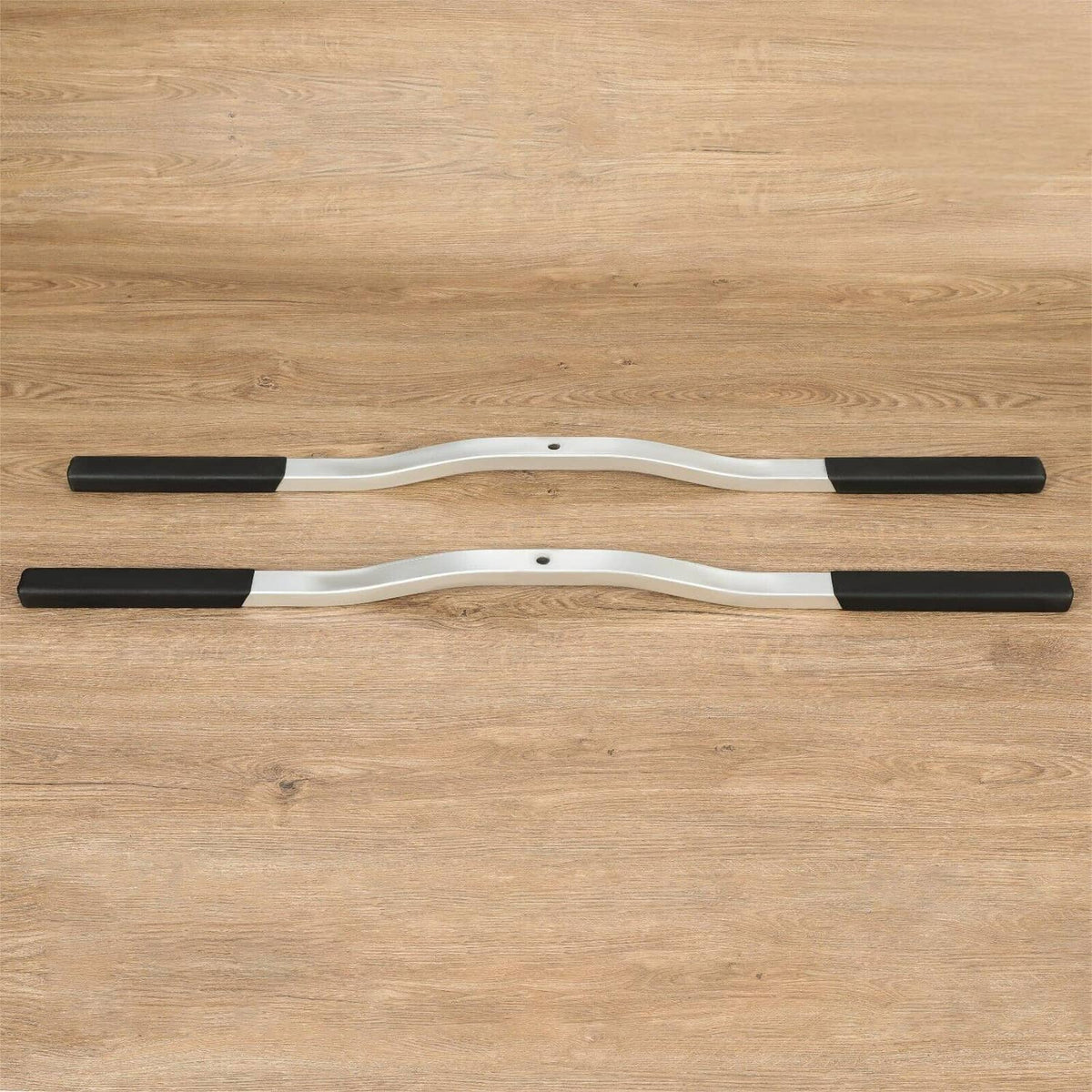 Two-piece ski tie-down bar set with black rubber boots and silver frame