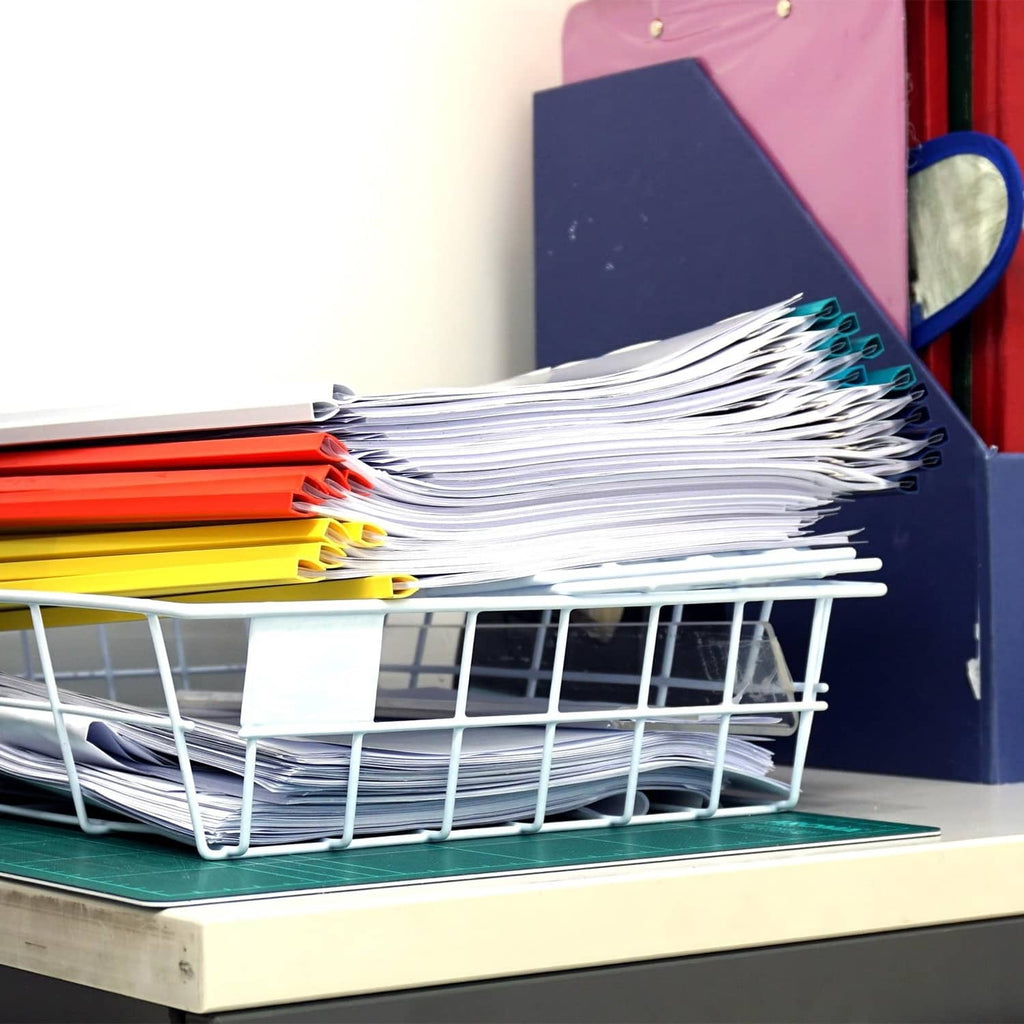Slide-grip binding bars securing a pile of documents in a wire tray