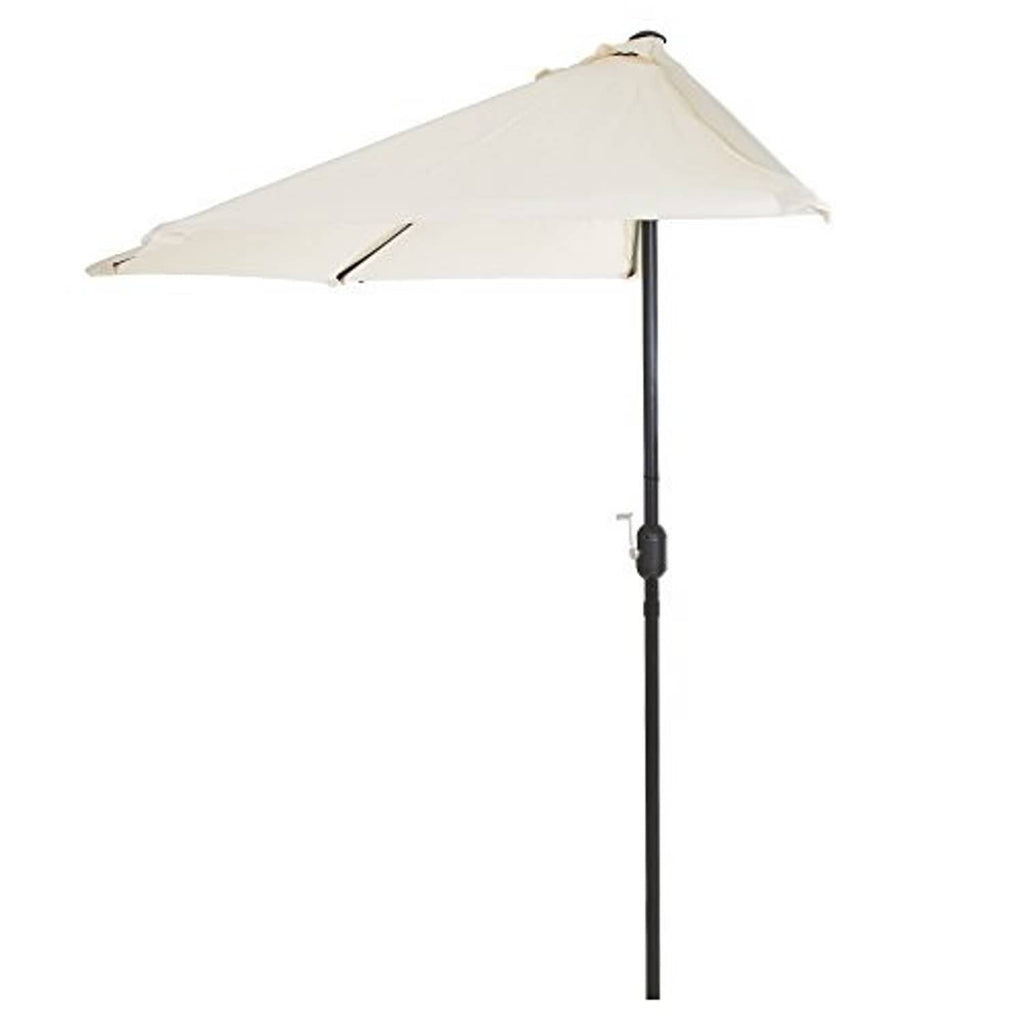 Tan half-round patio umbrella angled view with black pole and open canopy