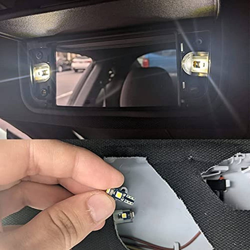 Hand installing a T5 LED bulb into a dashboard socket with twist-lock contacts