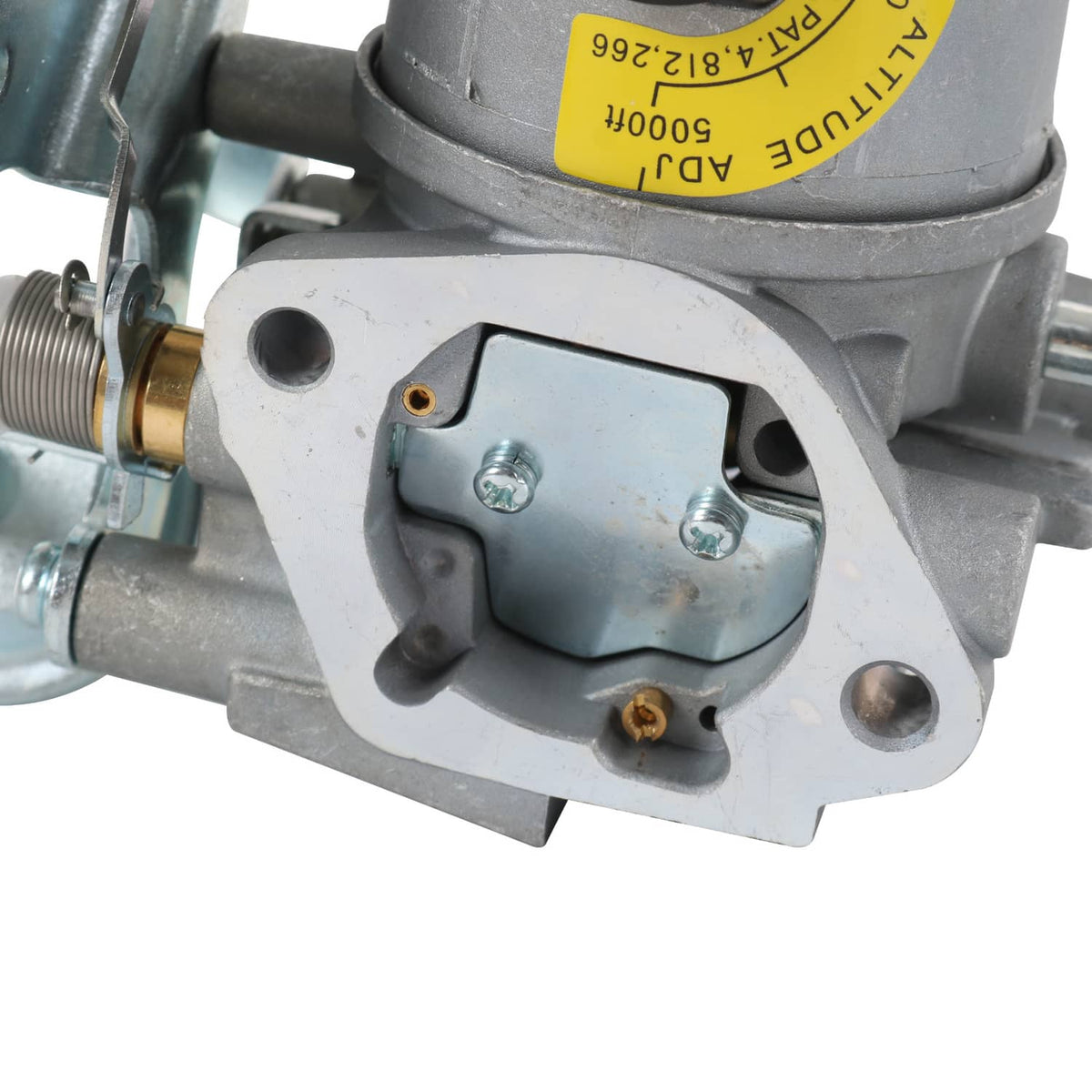 Carburetor mounting cover with screws, brass fitting, and yellow identification label