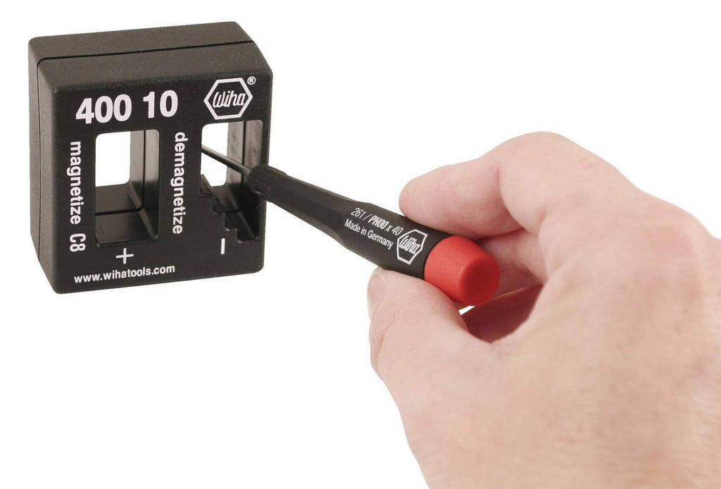 Wiha magnetizer/demagnetizer block with red-and-black handle tool being used