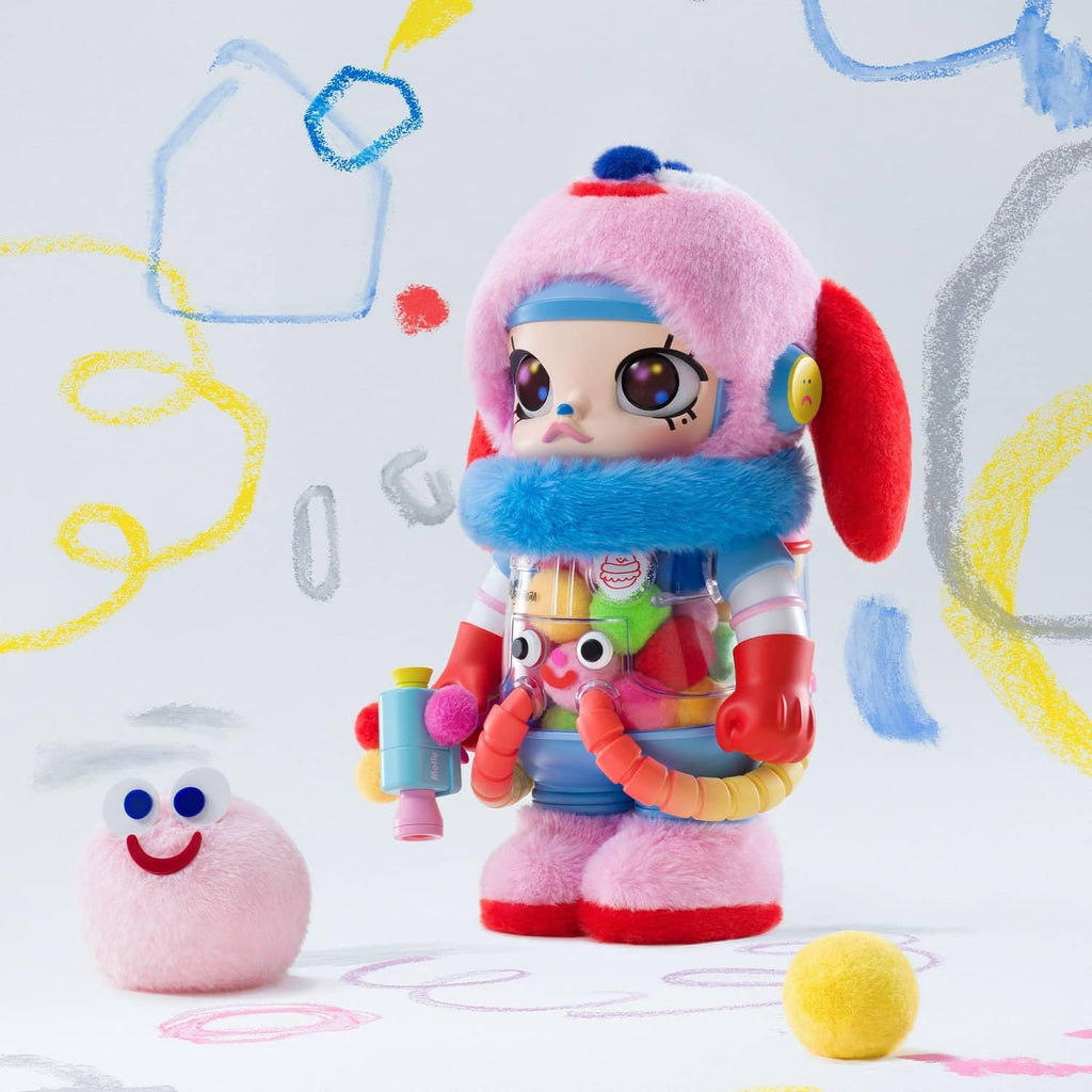 Pink plush astronaut collectible figure standing with small plush creature and colorful balls