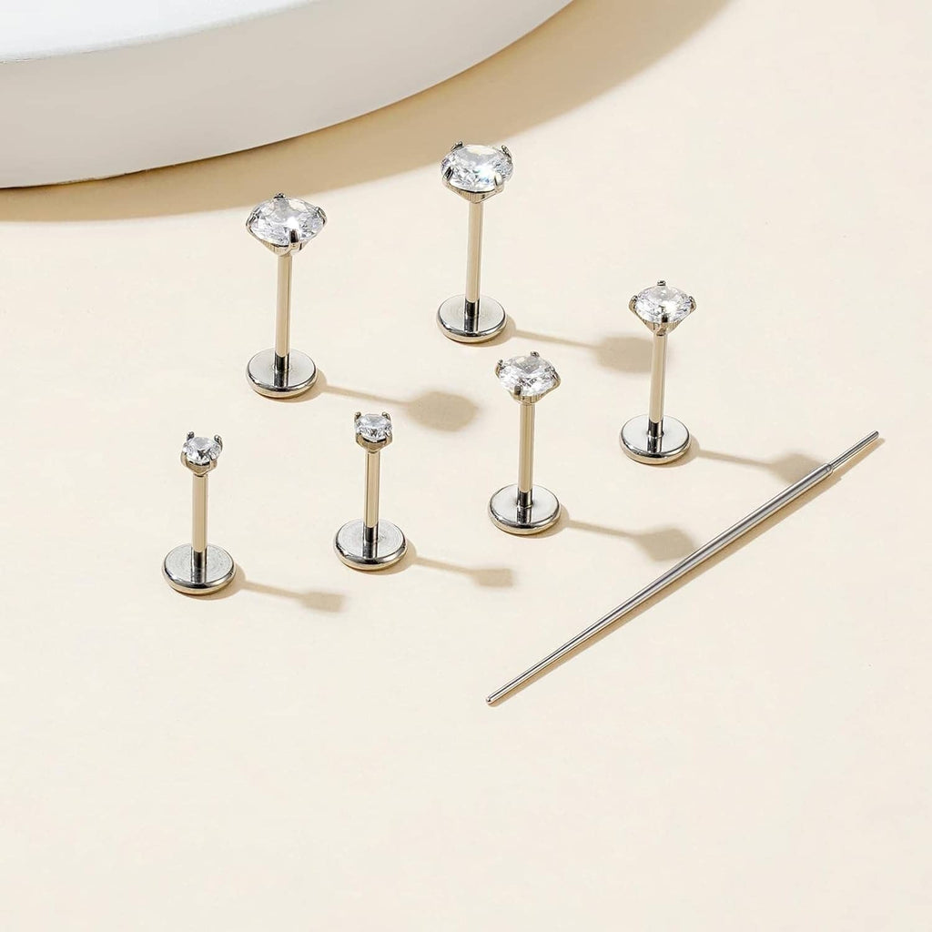 Silver flat-back CZ barbell earrings set with round stones and straight posts