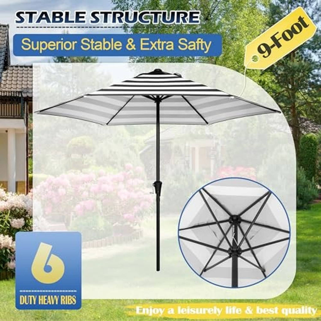Patio market umbrella with black-and-white striped canopy, open ribs, and dark center pole