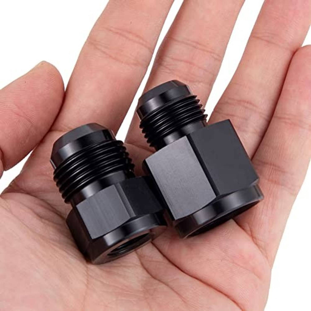 Black AN flare reducer adapters, two-piece set held in hand with threaded fittings