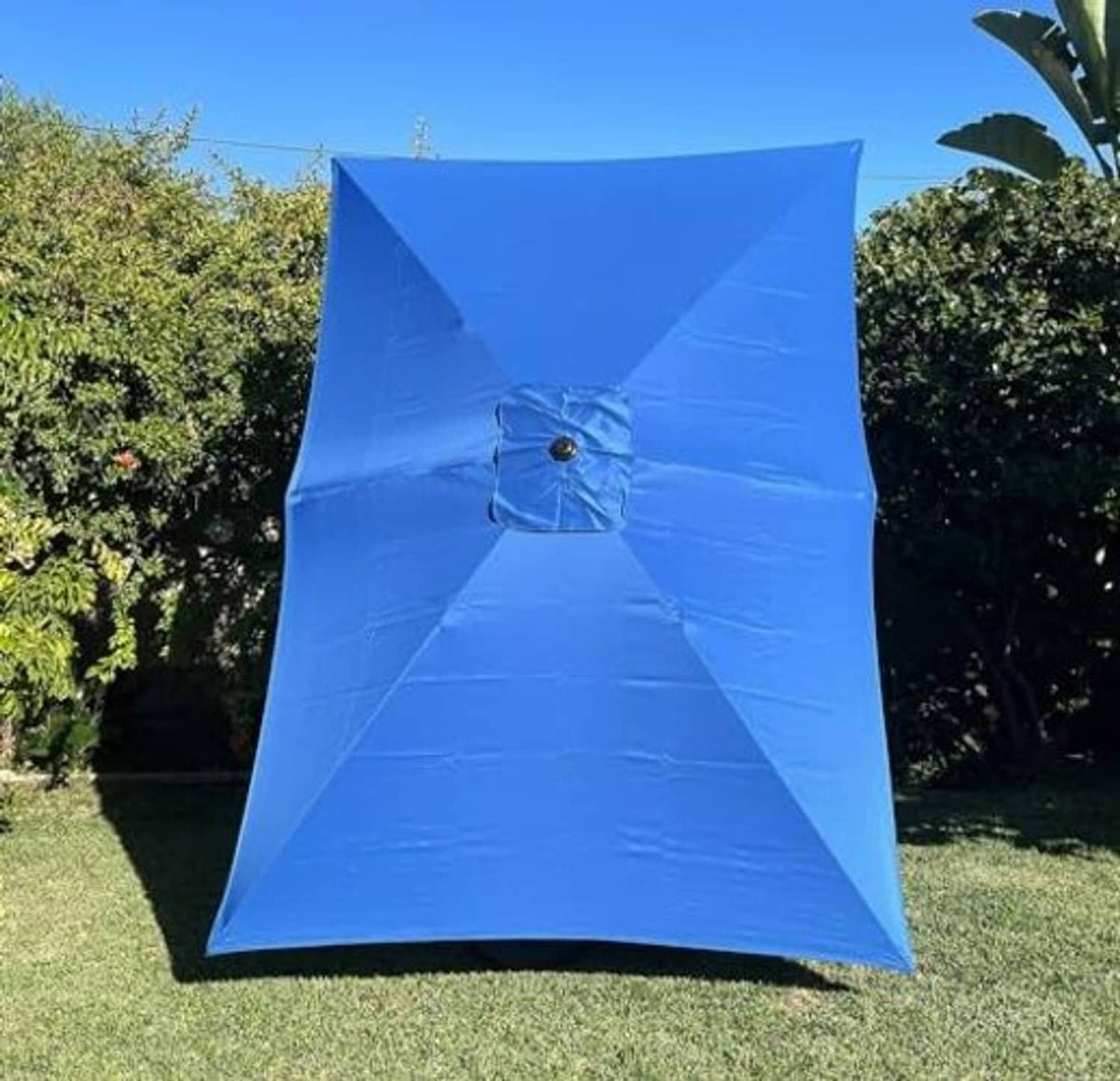 Blue rectangular umbrella canopy, front view with round grommet and visible seam lines.