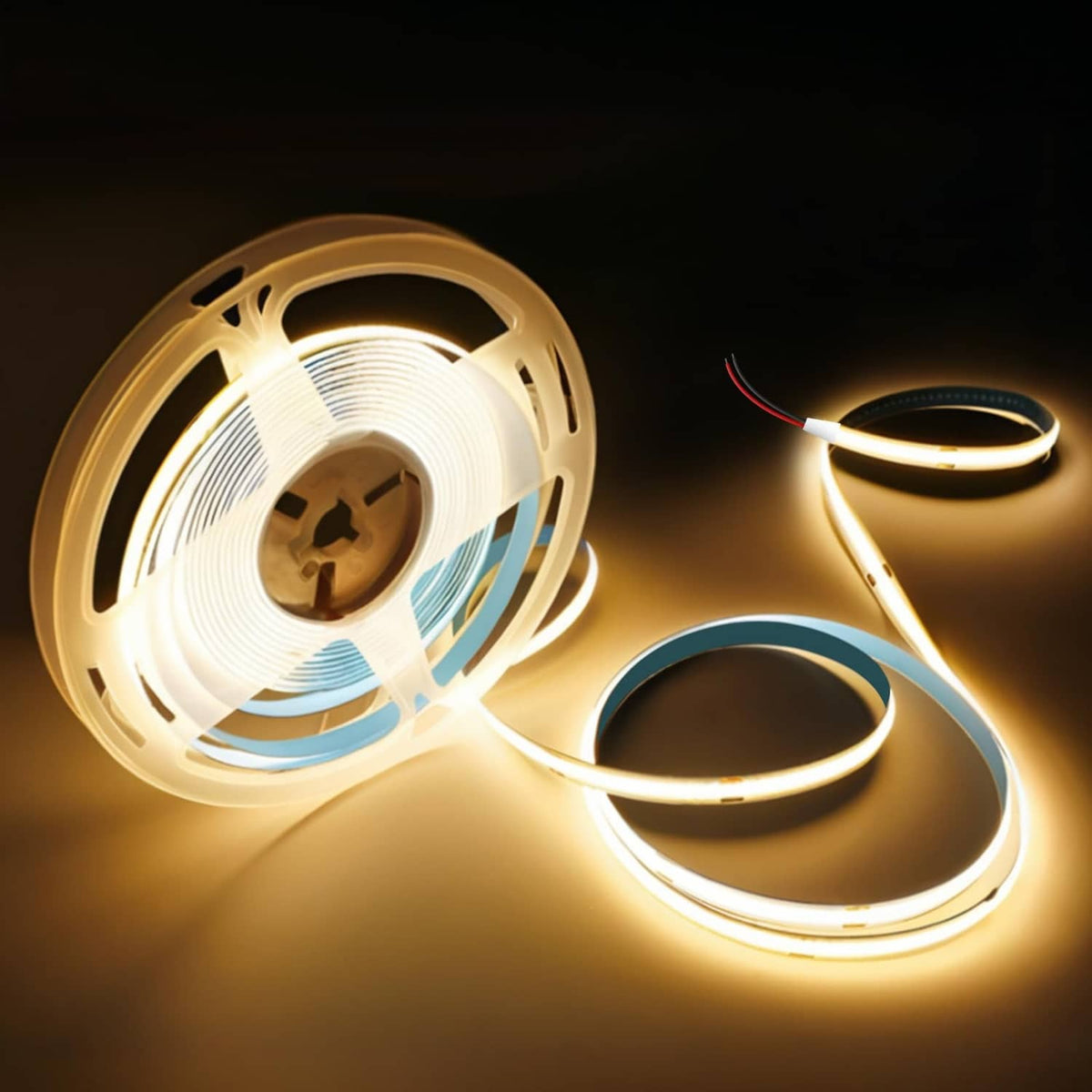 Warm white LED strip coils with exposed wire leads and glowing strips.