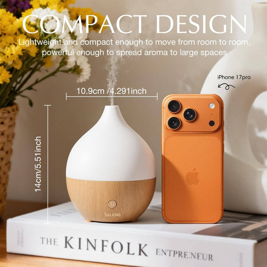 Compact essential oil diffuser with white cap and wood-grain base
